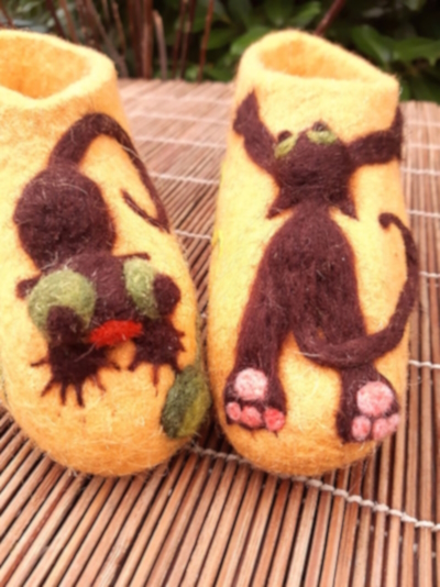 Felt shioes with needle felted design Felt shioes with needle felted design